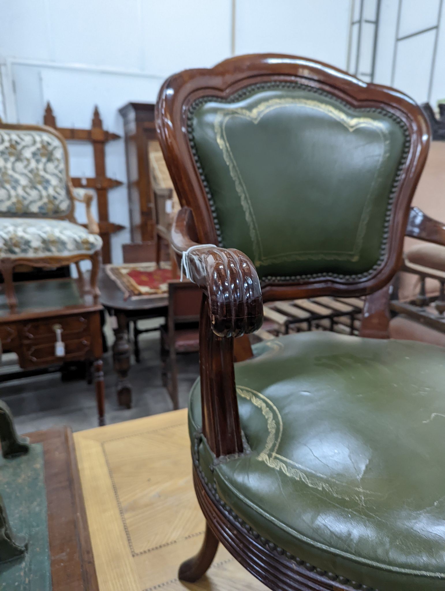 A Victorian style mahogany and green leather swivel desk chair, width 60cm, depth 50cm, height 96cm